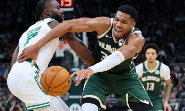 Giannis Antetokounmpo of the Milwaukee Bucks is defended by Jaylen Brown of the Boston Celtics during the first half of the game at Fiserv Forum.