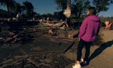 Jamie Randall looks at the rubble of her home in Camarillo