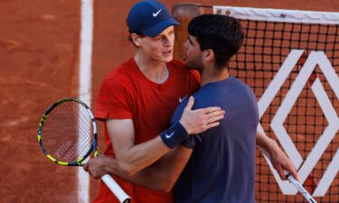 Alcaraz and Sinner shake hands after the former's victory in the French Open semifinals.