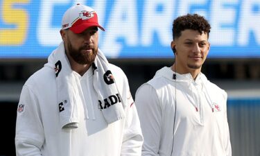 Travis Kelce and Patrick Mahomes of the Kansas City Chiefs look on from the sidelines during a game against the Los Angeles Chargers at SoFi Stadium in Inglewood