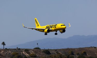 Spirit Airlines plane lands on the south runway at the Los Angeles International Airport.