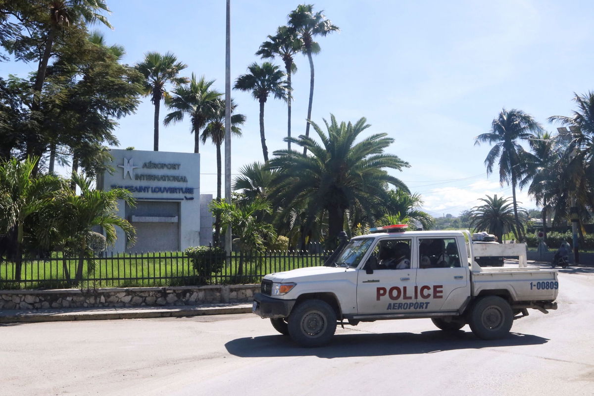 <i>Marckinson Pierre/Reuters via CNN Newsource</i><br/>A police vehicle drives outside Toussaint Louverture International Airport in Port-au-Prince