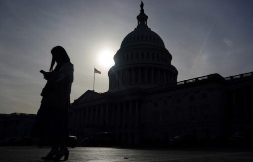 A person uses a mobile phone outside the U.S. Capitol building on Wednesday