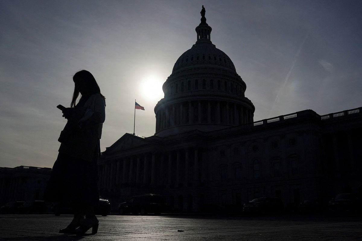 <i>Nathan Howard/Reuters via CNN Newsource</i><br/>A person uses a mobile phone outside the U.S. Capitol building on Wednesday