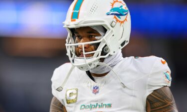 Tagovailoa warms up before the game between the Dolphins and the Rams at SoFi Stadium