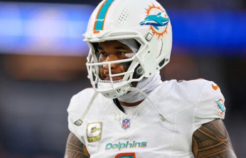 Tagovailoa warms up before the game between the Dolphins and the Rams at SoFi Stadium