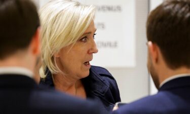 Le Pen outside the courtroom on Wednesday