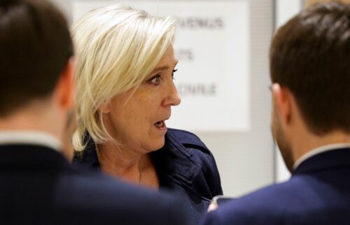 Le Pen outside the courtroom on Wednesday