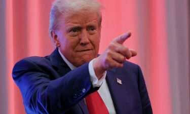 President-elect Donald Trump gestures as he meets with House Republicans on Capitol Hill in Washington