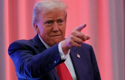 President-elect Donald Trump gestures as he meets with House Republicans on Capitol Hill in Washington