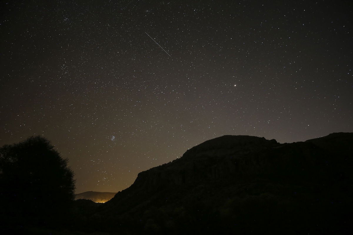 <i>Dogukan Keskinkilic/Anadolu Agency/Getty Images via CNN Newsource</i><br/>A meteor from the Leonids is seen streaking across the sky over Ankara