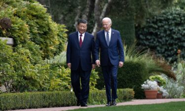 President Joe Biden and Chinese President Xi Jinping walk together after a meeting during the Asia-Pacific Economic Cooperation (APEC) Leaders' week in Woodside