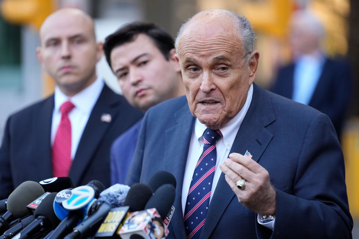 <i>Seth Wenig/AP via CNN Newsource</i><br/>Former New York Mayor Rudy Giuliani speaks the media as he leaves court in New York on November 7.