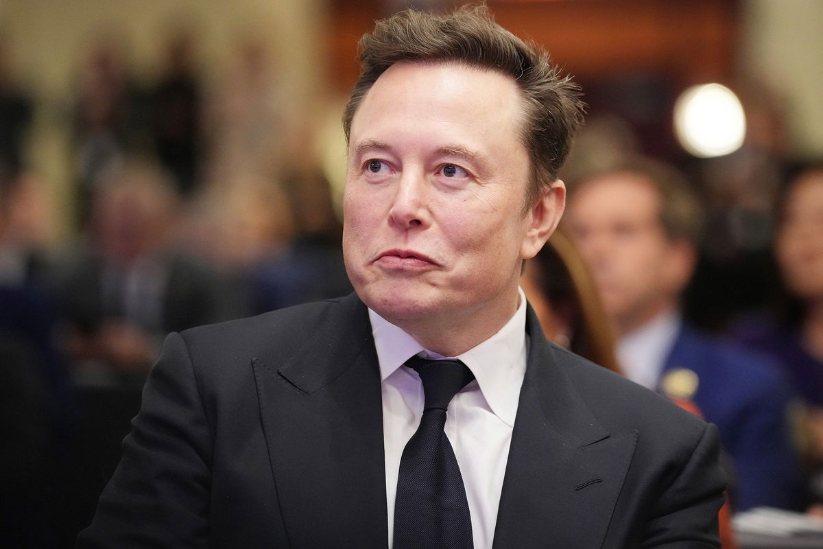 <i>Andrew Harnik/Getty Images via CNN Newsource</i><br/>Elon Musk listens as President-elect Donald Trump addresses a House Republican Conference meeting at the Hyatt Regency on Capitol Hill on November 13