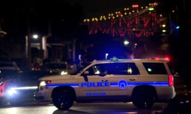 Police respond to the scene of a shooting in New Orleans on November 17.  Two people were killed and 10 others were injured in two shootings during a popular New Orleans second-line parade on Sunday.