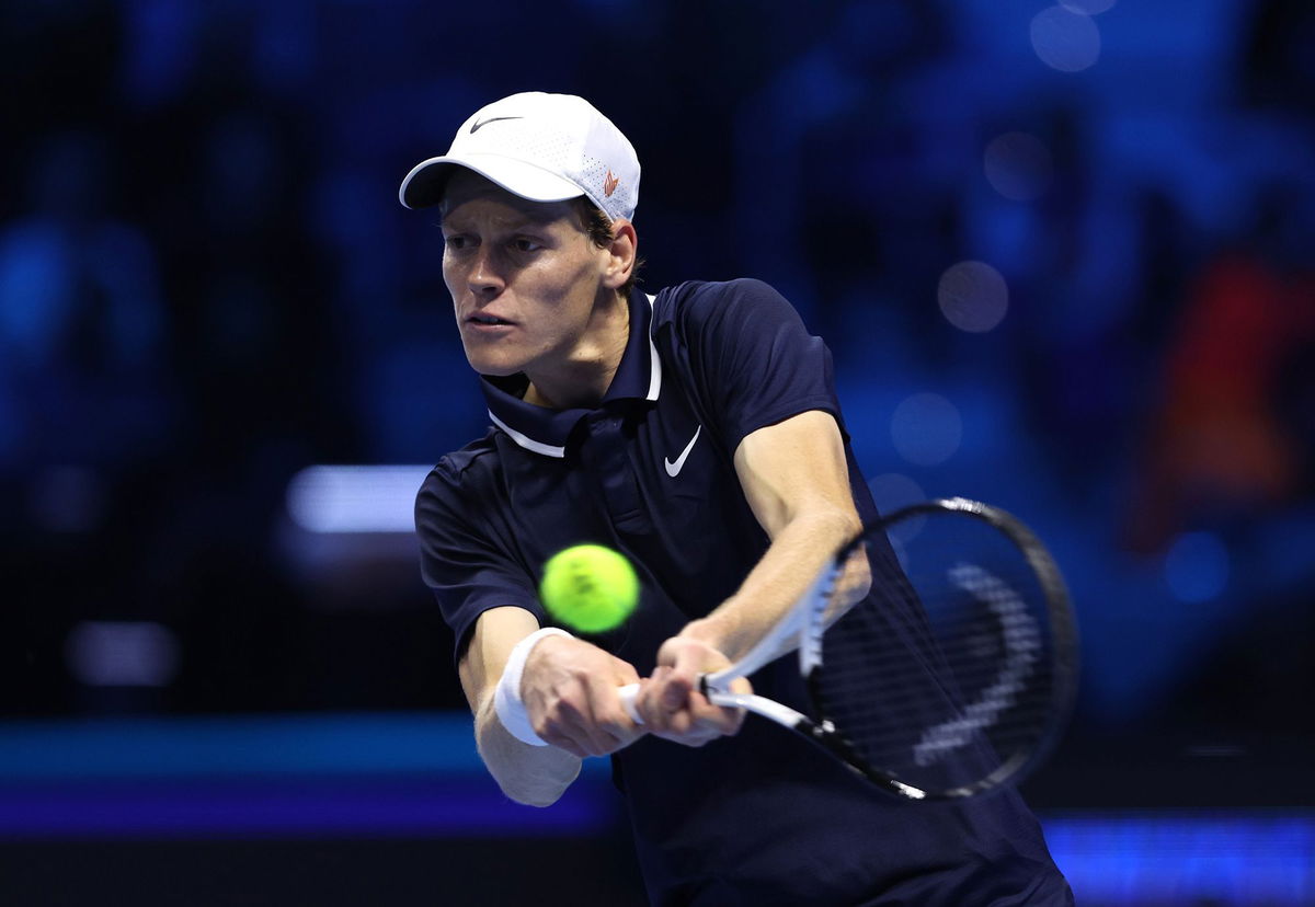 <i>Clive Brunskill/Getty Images via CNN Newsource</i><br/>Sinner plays a backhand during the match.