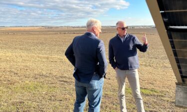 Republican voter Chris Mudd gives a tour of a solar panel installation near Cedar Falls