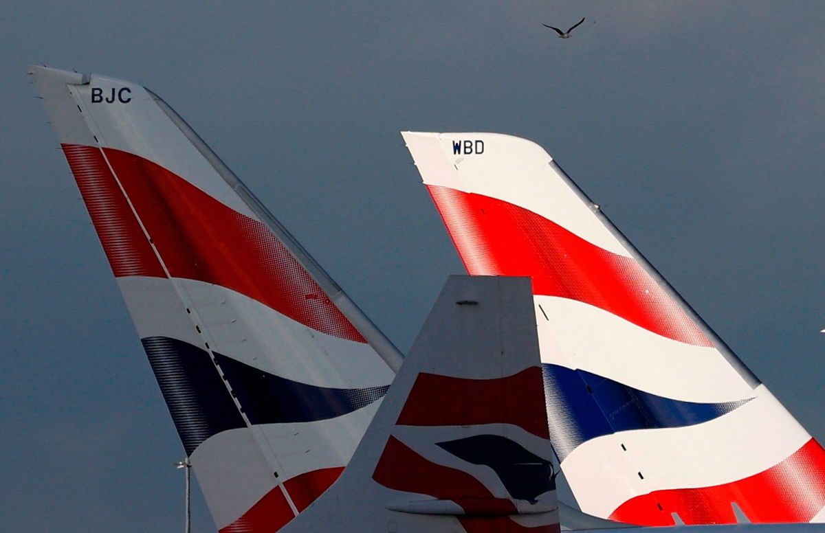 <i>Adrian Dennis/AFP/Getty Images/File via CNN Newsource</i><br/>Sunlight illuminates the tailfins of British Airways aircraft at Terminal 5 of London Heathrow Airport on February 5