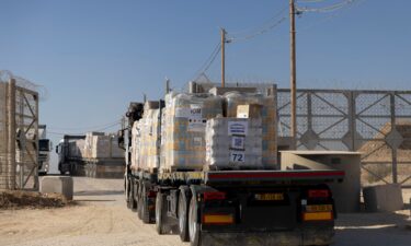 Trucks carrying humanitarian aid cross into the Gaza Strip on November 11 at the Erez Crossing.