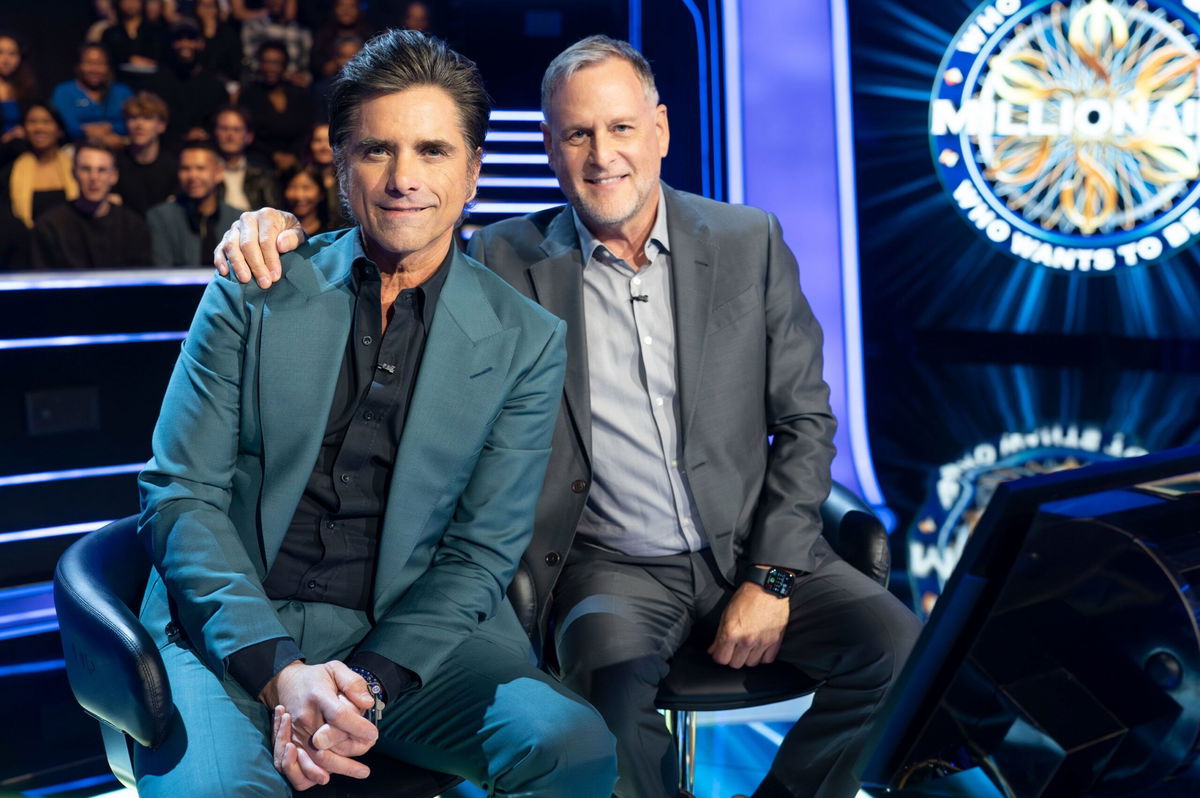 <i>Chris Willard/Disney/ABC/Getty Images/File via CNN Newsource</i><br/>John Stamos and Dave Coulier on 'Who Wants to be a Millionaire' in July.