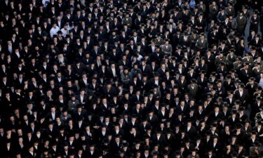 Ultra-Orthodox Jewish men in Jerusalem protest a Supreme Court ruling that they cannot be exempt from military service in June.