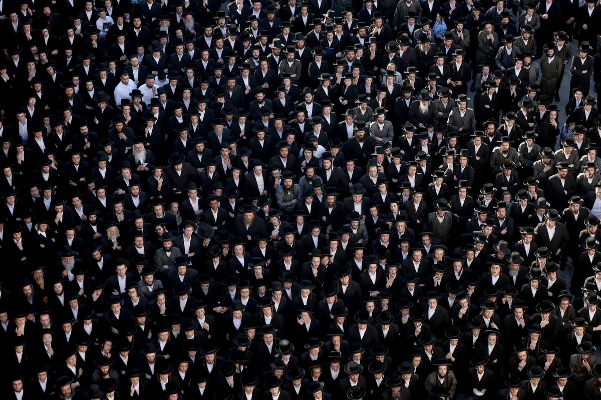 <i>Ronen Zvulun/Reuters/File via CNN Newsource</i><br/>Ultra-Orthodox Jewish men in Jerusalem protest a Supreme Court ruling that they cannot be exempt from military service in June.