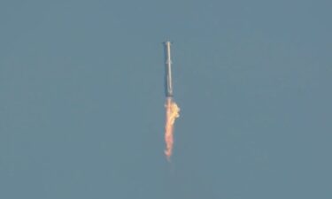 A still from SpaceX's livestream shows the Super Heavy rocket booster heading back down to Earth on Tuesday.