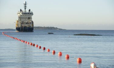 Submarine telecommunications cable being laid to the bottom of the Baltic Sea by cable laying ship "Ile de Brehat" off the shore of Helsinki.