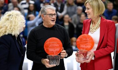 UConn head coach Geno Auriemma and associate head coach Chris Dailey honored before the game on November 20.