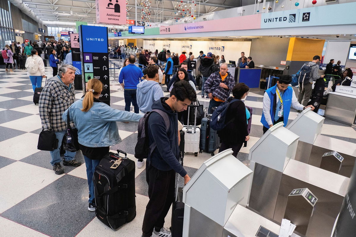 <i>Vincent Alban/Reuters/FILE via CNN Newsource</i><br/>People check in for flights ahead of the Thanksgiving holiday at O’Hare International Airport in Chicago on November 22