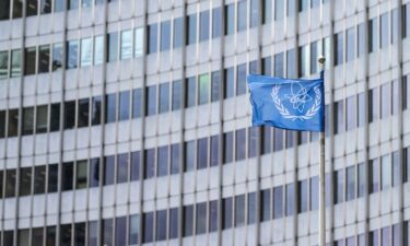 The IAEA flag flutters in the wind outside of the IAEA headquarters during the International Atomic Energy Agency IAEA's Board of Governors meeting at the agency's headquarters in Vienna