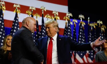 UFC chief Dana White greets Donald Trump during an election night event on November 06