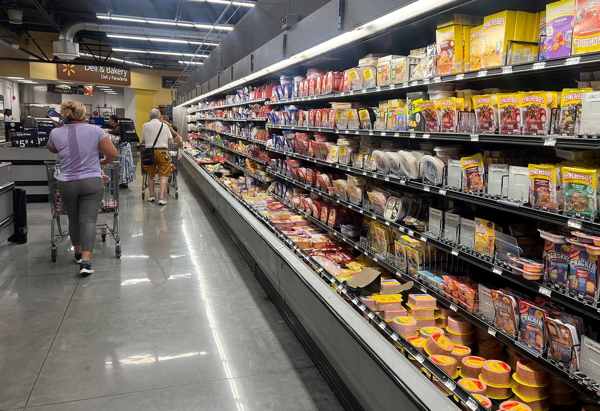 <i>Joe Raedle/Getty Images via CNN Newsource</i><br/>Customers shop in the deli meat aisle of a grocery store on October 17 in Miami