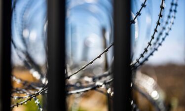 Razor wire coils across the Mexico landscape on the other side go the US border wall on February 3 in Eagle Pass