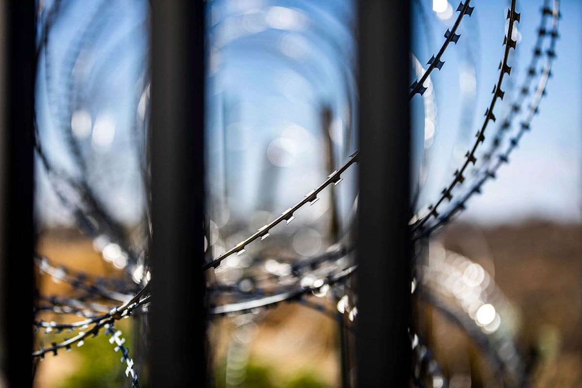 <i>MIchael Nigro/Sipa USA/AP/File via CNN Newsource</i><br/>Razor wire coils across the Mexico landscape on the other side go the US border wall on February 3 in Eagle Pass