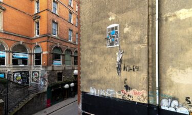 Banksy painted "Well Hung Lover" on a Bristol building back in 2006.