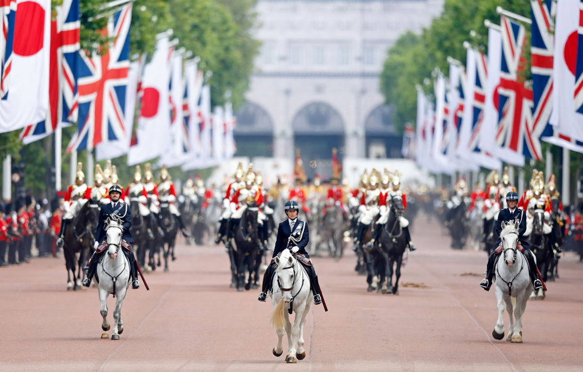 <i>Max Mumby/Indigo/Getty Images via CNN Newsource</i><br/>Mounted police officers lead a carriage procession carrying King Charles III