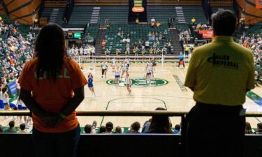 Workers monitor a women's volleyball game between San Jose State and Colorado State in Fort Collins