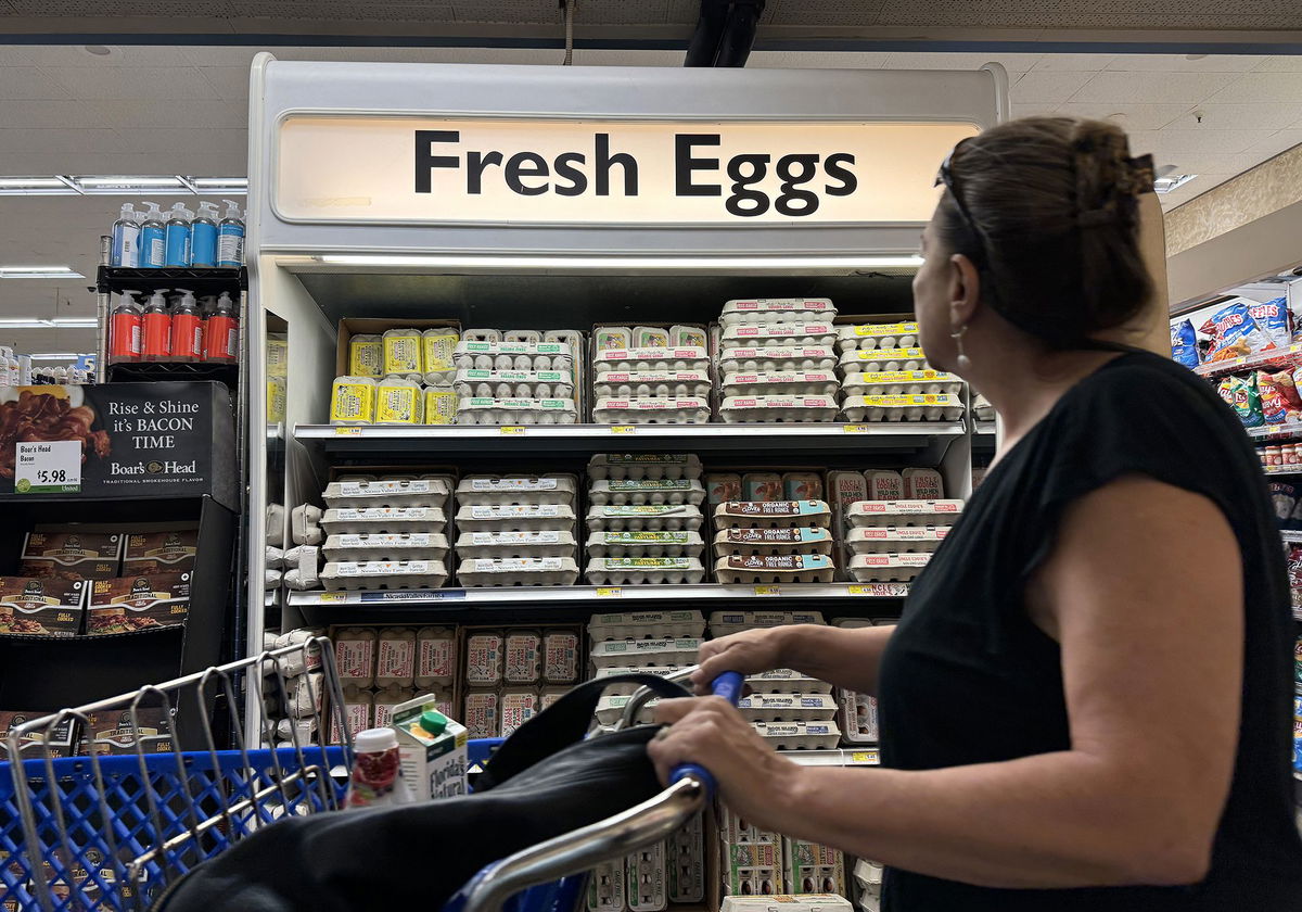 A customer walks by a display of fresh eggs at a grocery store in San Anselmo, California on September 25. Egg prices have risen steadily over the past two years.