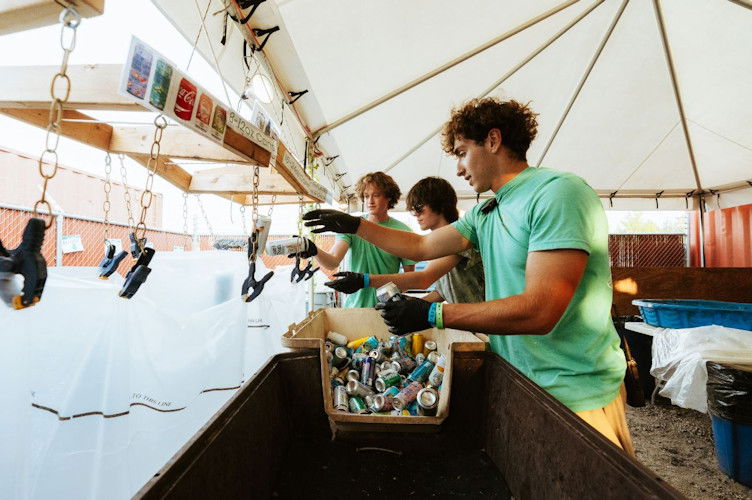  Members of the Hayden Homes Amphitheater Green team sort through aluminum cans at the venue’s Michael Franti show on Aug. 14, 2024. The amphitheater recycled nearly 17,000 pounds of aluminum cans in 2024.