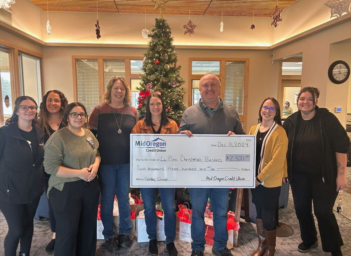 Mid Oregon's check presentation to the La Pine Christmas Bank Association.