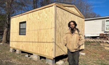 A team of volunteers for weeks have been working on building 12-feet by 16-feet cabins. Orlondo Morris is a recipient of one of the units on his grandmother’s property.