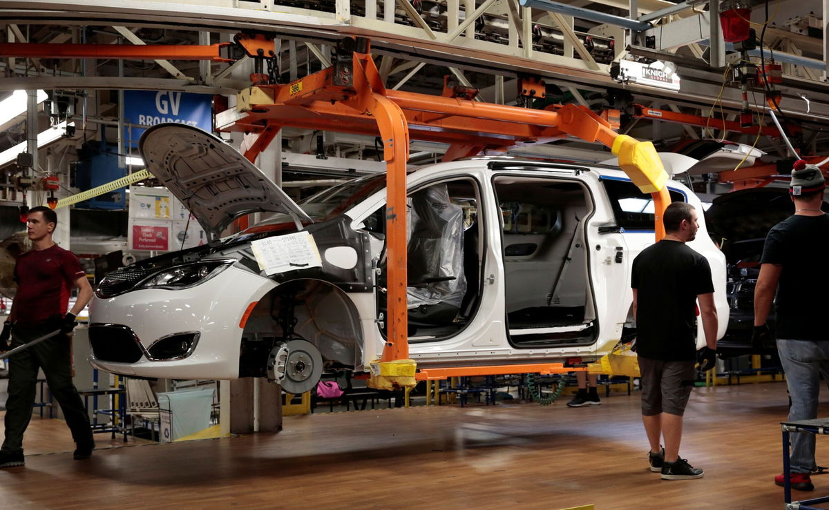 <i>Rebecca Cook/Reuters via CNN Newsource</i><br/>A 2019 Chrysler Pacifica minivan moves down the assembly line at the FCA Windsor Assembly plant in Windsor