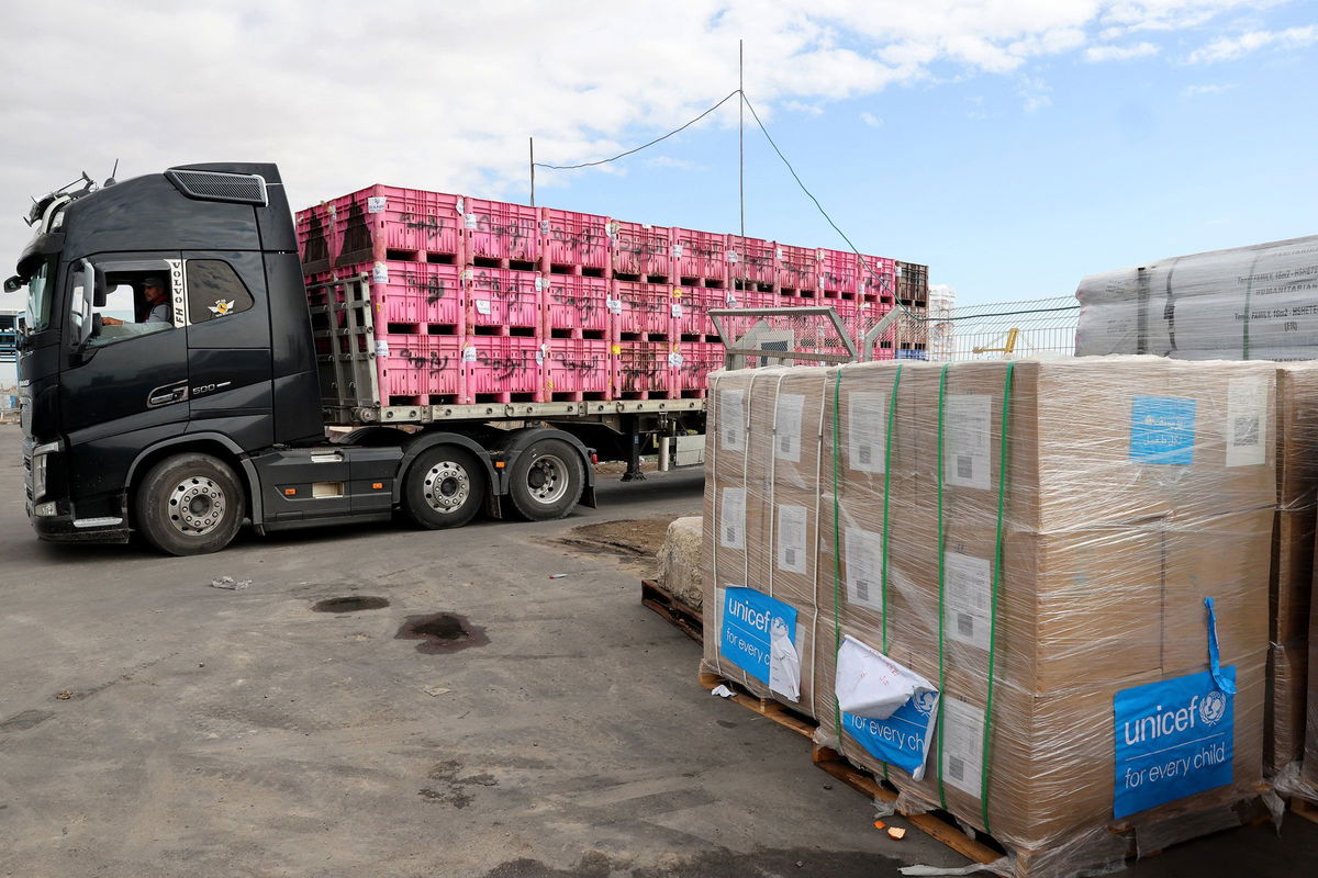 <i>Jack Guez/AFP/Getty Images via CNN Newsource</i><br/>A picture taken during a tour organized by the Israeli Army shows an Israeli truck transporting aid destined for the Gaza Strip at a drop-off area near the Kerem Shalom crossing