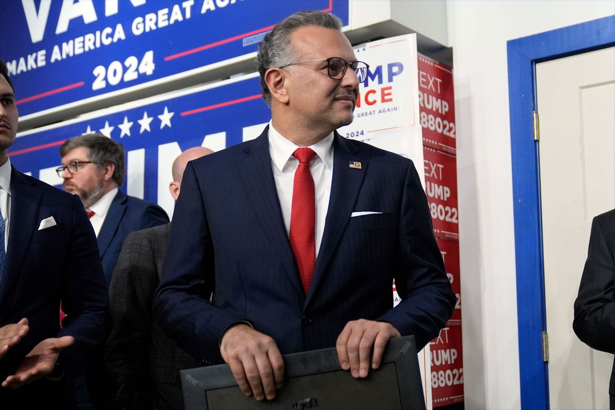 <i>Evan Vucci/AP via CNN Newsource</i><br/>Massad Boulos listens as Former President Donald Trump speaks at a campaign office on October 18 in Hamtramck