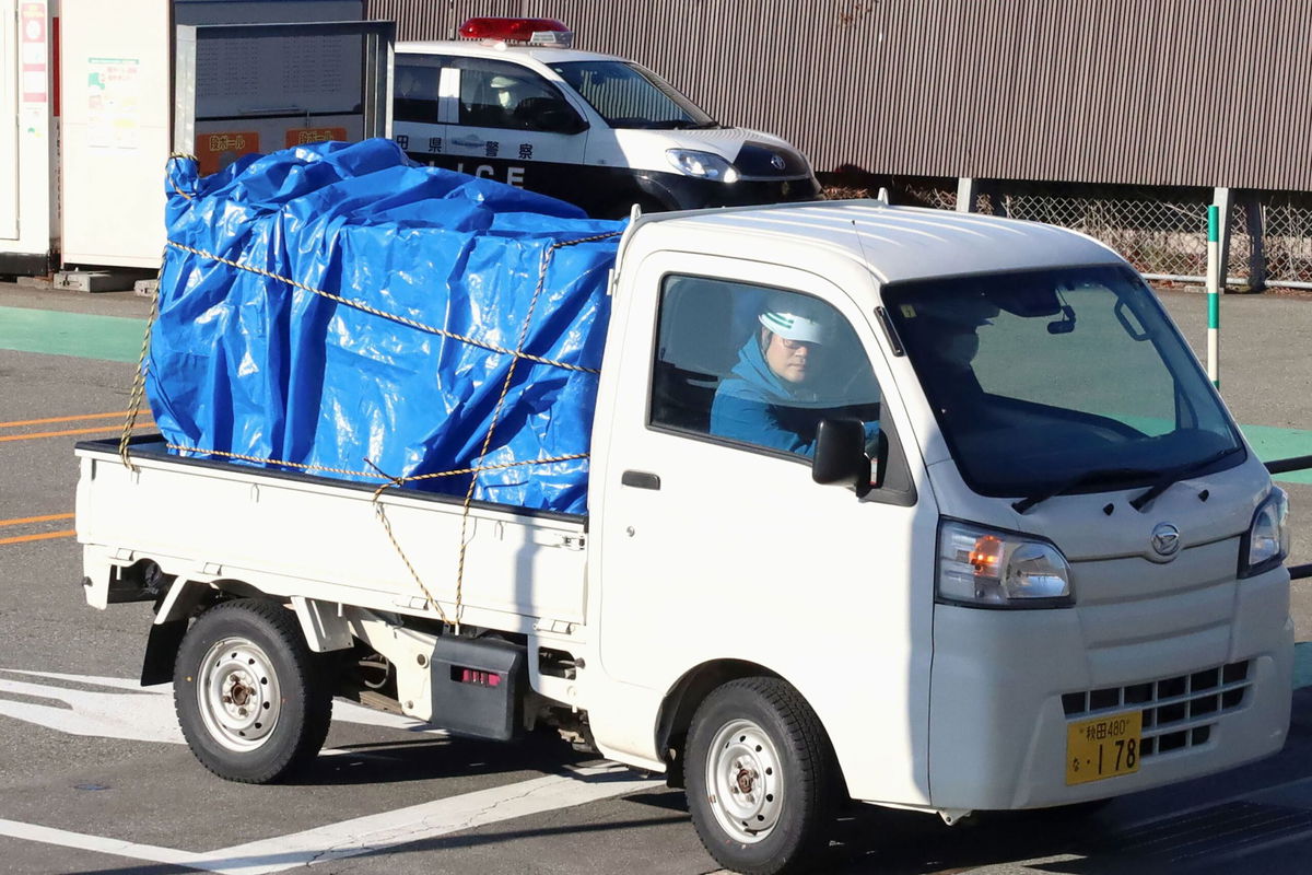 <i>Kyodo News/Getty Images via CNN Newsource</i><br/>A minitruck carries a bear after it was trapped at a supermarket in Akita