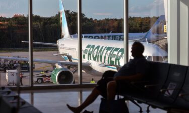 A Frontier Airlines plane sits on the tarmac at Cancun International Airport in Mexico. Frontier Airlines is the latest no-frills carrier getting into the premium seating game — with what it’s referring to as “first class-style” seats.