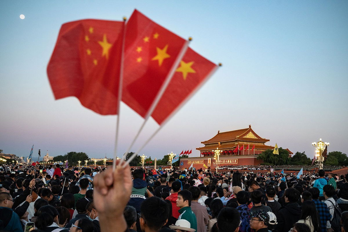 <i>Andrea Verdelli/ Bloomberg/Getty Images via CNN Newsource</i><br/>Visitors gather for the flag raising ceremony at Tiananmen Square to mark National Day in Beijing on Sunday