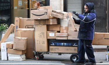 A Fedex worker sorts through packages set for delivery in Manhattan on December 2. Consumers spent a record $13.3 billion on Cyber Monday