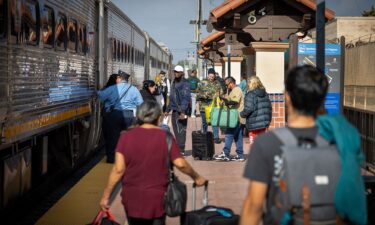 Passengers at the Santa Ana Regional Transportation Center in California board the Amtrak Surfliner for post-Thanksgiving travel.